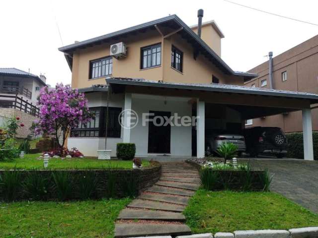 Casa em condomínio fechado com 4 quartos à venda na Estrada Capitão Gentil Machado de Godoy, 4500, Vila Elsa, Viamão, 380 m2 por R$ 1.200.000