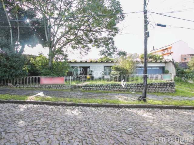 Casa com 4 quartos à venda na Rua Panambi, 54, Cavalhada, Porto Alegre, 256 m2 por R$ 900.000