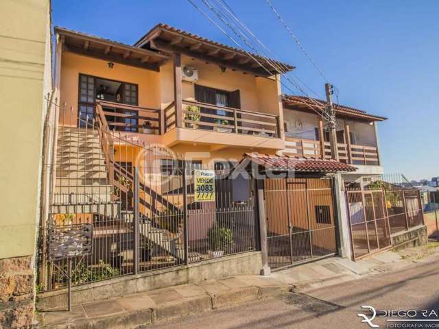 Casa com 5 quartos à venda na Rua Waldomiro Silveira Dias, 40, Jardim Itu Sabará, Porto Alegre, 253 m2 por R$ 450.000