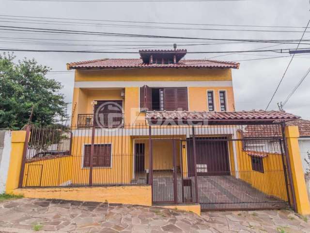 Casa com 4 quartos à venda na Travessa Clemêncio Wallau, 24, Coronel Aparício Borges, Porto Alegre, 484 m2 por R$ 740.000