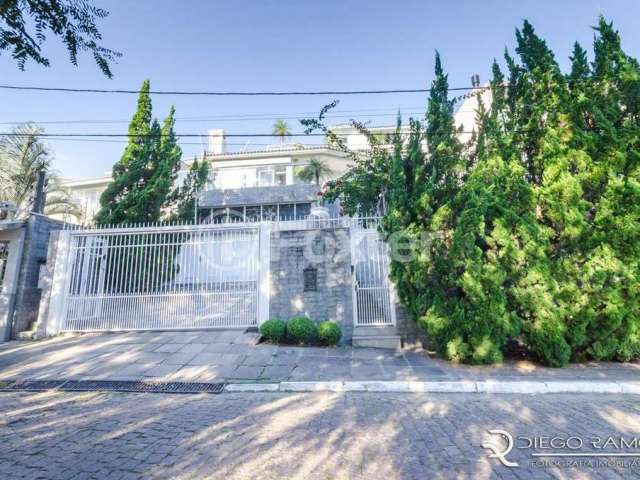 Casa com 3 quartos à venda na Rua Alcebíades Antônio dos Santos, 550, Nonoai, Porto Alegre, 399 m2 por R$ 1.790.000