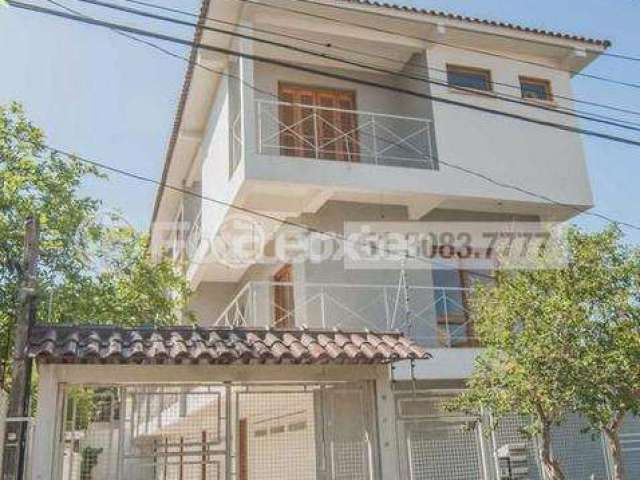 Casa em condomínio fechado com 3 quartos à venda na Rua Jamil Antônio José, 46, Nonoai, Porto Alegre, 145 m2 por R$ 656.900