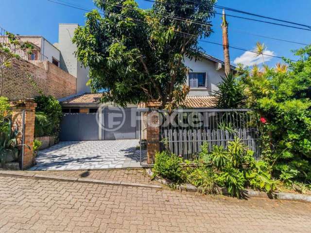 Casa em condomínio fechado com 3 quartos à venda na Estrada João Passuelo, 1060, Vila Nova, Porto Alegre, 192 m2 por R$ 720.000