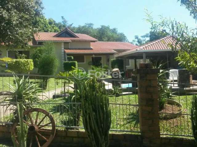 Casa com 4 quartos à venda na Rua Olmiro Lametta Viegas, 6, Hípica, Porto Alegre, 260 m2 por R$ 950.000