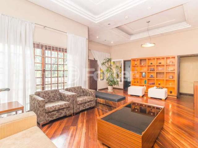 Casa com 4 quartos à venda na Avenida Fábio Araújo Santos, 1472, Nonoai, Porto Alegre, 353 m2 por R$ 874.000