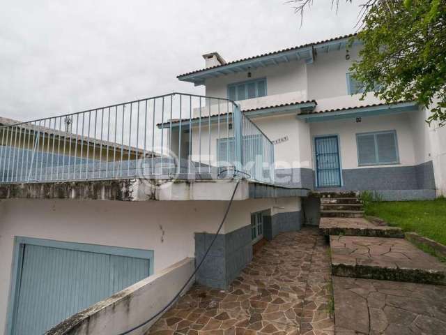 Casa com 4 quartos à venda na Rua Padre João Batista Reus, 1767, Vila Conceição, Porto Alegre, 266 m2 por R$ 690.000