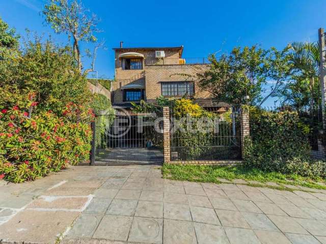 Casa com 4 quartos à venda na Rua Arapei, 325, Cristal, Porto Alegre, 231 m2 por R$ 650.000