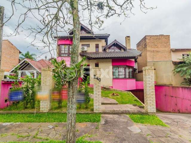 Casa em condomínio fechado com 4 quartos à venda na Rua Jacarandá, 240, Santo Onofre, Viamão, 334 m2 por R$ 750.000