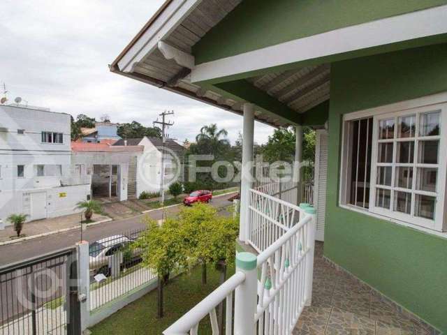 Casa com 3 quartos à venda na Rua País de Gales, 551, Marechal Rondon, Canoas, 181 m2 por R$ 850.000