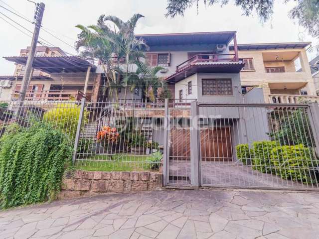 Casa com 6 quartos à venda na Rua Fernando Abbott, 1055, Cristo Redentor, Porto Alegre, 431 m2 por R$ 1.540.000