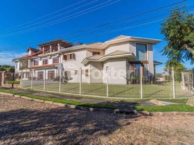 Casa com 4 quartos à venda na Rua Comendador José Júlio de Mello, 35, Teresópolis, Porto Alegre, 297 m2 por R$ 1.590.000