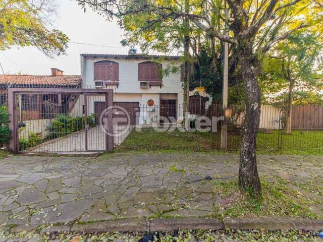 Casa com 3 quartos à venda na Rua Comandai, 541, Cristal, Porto Alegre, 1155 m2 por R$ 840.000