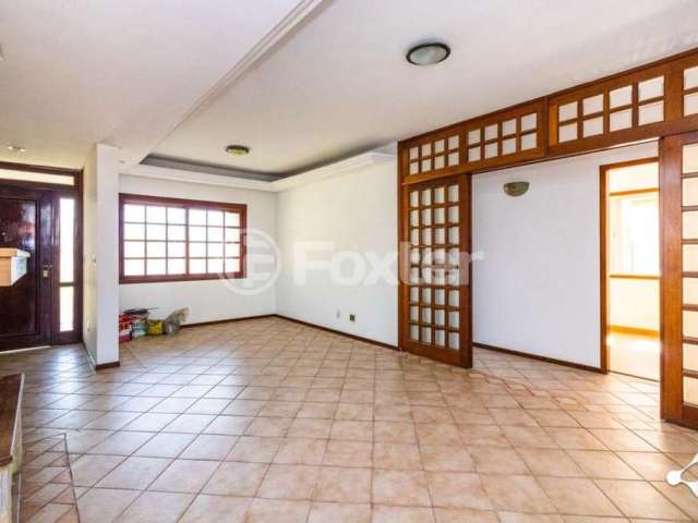 Casa com 4 quartos à venda na Rua Augusto Comte, 45, Cavalhada, Porto Alegre, 228 m2 por R$ 1.240.000