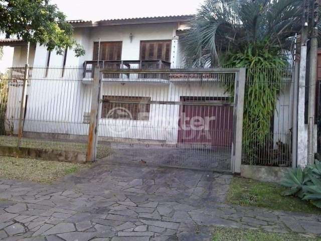 Casa com 4 quartos à venda na Rua Araponga, 6, Chácara das Pedras, Porto Alegre, 256 m2 por R$ 1.800.000