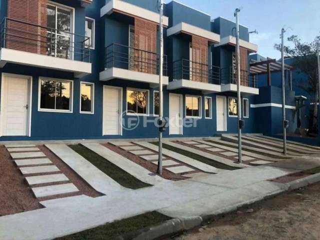 Casa em condomínio fechado com 2 quartos à venda na Rua Pero Vaz de Caminha, 177, Tarumã, Viamão, 52 m2 por R$ 220.000