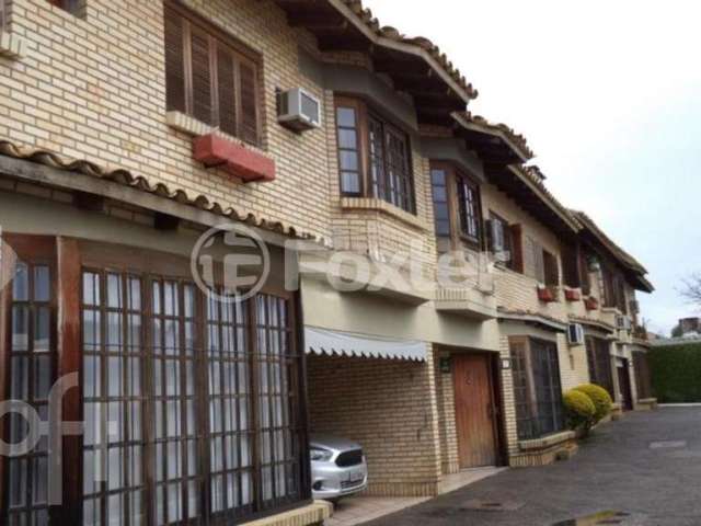 Casa em condomínio fechado com 3 quartos à venda na Rua Jacipuia, 333, Guarujá, Porto Alegre, 129 m2 por R$ 420.000