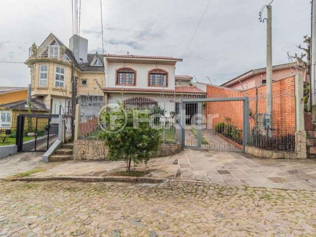 Casa com 4 quartos à venda na Rua Esteio, 220, Cavalhada, Porto Alegre, 244 m2 por R$ 810.000