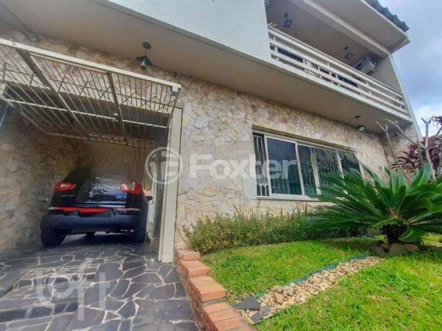 Casa com 4 quartos à venda na Rua Ibirubá, 232, Cavalhada, Porto Alegre, 250 m2 por R$ 750.000