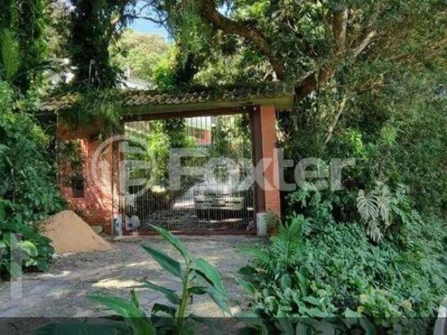 Casa em condomínio fechado com 3 quartos à venda na Rua Hygino Russi Lima, 540, Ponta Grossa, Porto Alegre, 270 m2 por R$ 950.000