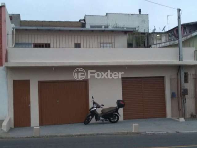 Casa com 3 quartos à venda na Avenida Tiradentes, 980, Aparecida, Alvorada, 215 m2 por R$ 424.000