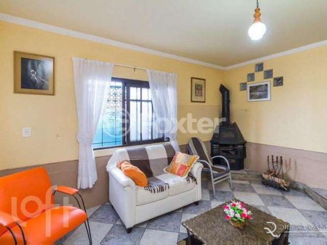 Casa com 3 quartos à venda na Rua Ângelo Passuelo, 420, Vila Nova, Porto Alegre, 296 m2 por R$ 499.000