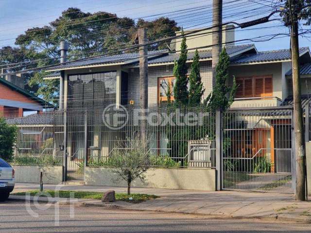 Casa com 4 quartos à venda na Rua Tenente Ary Tarrago, 1901, Jardim Itu Sabará, Porto Alegre, 447 m2 por R$ 1.600.000