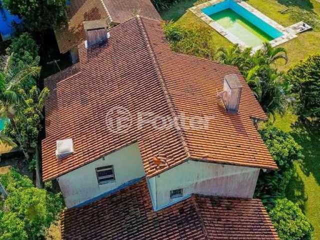 Casa em condomínio fechado com 5 quartos à venda na Avenida Firmino Octávio Bimbi, 255, Cavalhada, Porto Alegre, 400 m2 por R$ 1.700.000