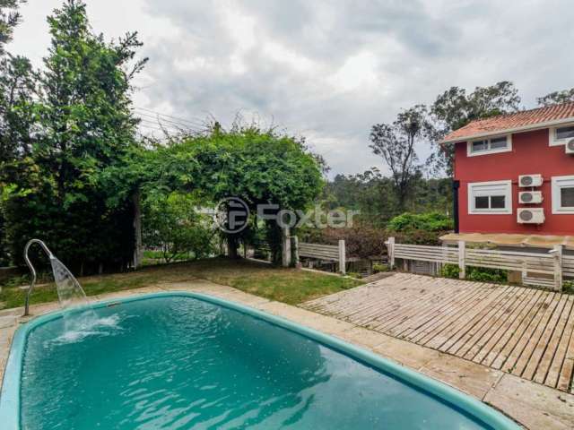 Casa em condomínio fechado com 3 quartos à venda na Rua Walter Emílio Schneider, 369, Lomba do Pinheiro, Porto Alegre, 300 m2 por R$ 940.000