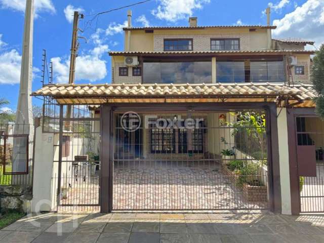 Casa com 4 quartos à venda na Rua Doutor Egydio Michaelsen, 58, Cavalhada, Porto Alegre, 202 m2 por R$ 626.000