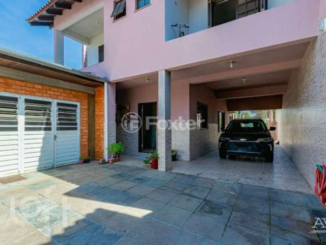 Casa com 5 quartos à venda na Rua das Camélias, 69, Igara, Canoas, 520 m2 por R$ 1.400.000