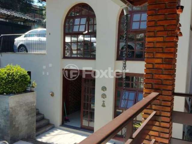 Casa com 3 quartos à venda na Rua dos Minuanos, 285, Espírito Santo, Porto Alegre, 291 m2 por R$ 1.100.000