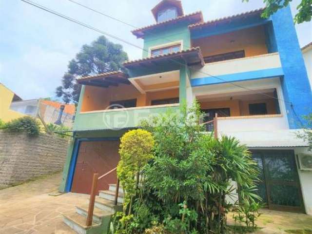 Casa com 3 quartos à venda na Rua Theonila Carvalho da Motta, 80, Parque Santa Fé, Porto Alegre, 438 m2 por R$ 1.150.000