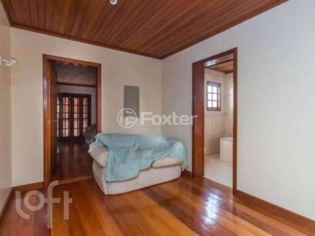 Casa com 5 quartos à venda na Rua Afonso Arinos, 475, Camaquã, Porto Alegre, 277 m2 por R$ 890.000