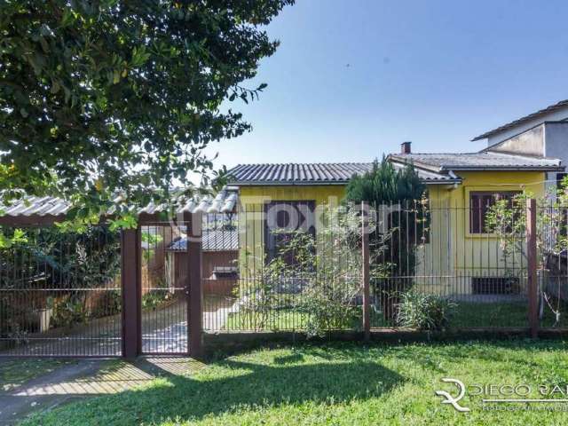 Casa com 3 quartos à venda na Avenida Outeiro, 368, Coronel Aparício Borges, Porto Alegre, 98 m2 por R$ 330.000