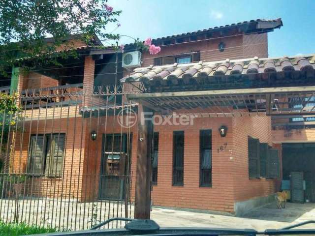 Casa com 4 quartos à venda na Estrada Aracaju, 167, Cavalhada, Porto Alegre, 205 m2 por R$ 698.000