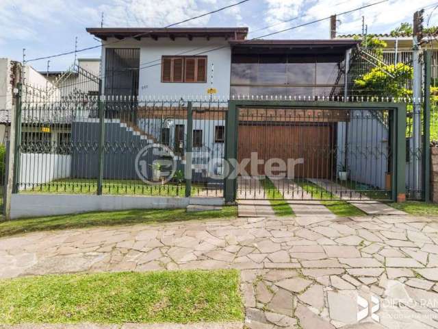 Casa com 3 quartos à venda na Rua Doutor Egydio Michaelsen, 250, Cavalhada, Porto Alegre, 292 m2 por R$ 992.000