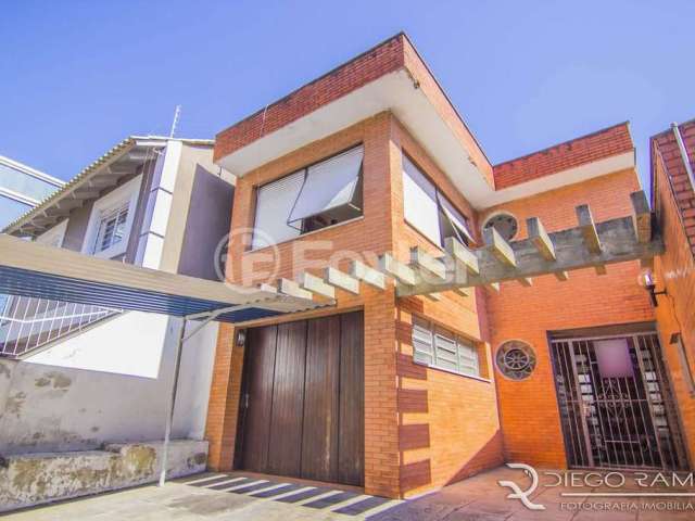 Casa com 4 quartos à venda na Rua Eudoro Berlink, 482, Auxiliadora, Porto Alegre, 214 m2 por R$ 1.799.000