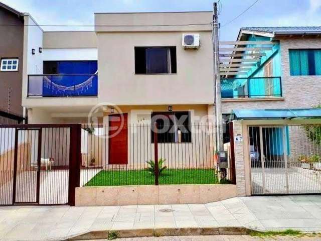 Casa com 3 quartos à venda na Rua Sol Nascente, 385, Lomba do Pinheiro, Porto Alegre, 142 m2 por R$ 475.000