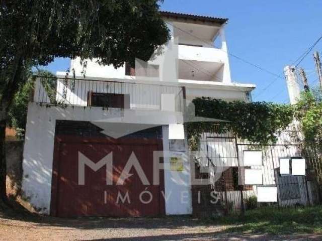 Casa com 6 quartos à venda na Avenida Vicente Monteggia, 586, Cavalhada, Porto Alegre por R$ 550.000