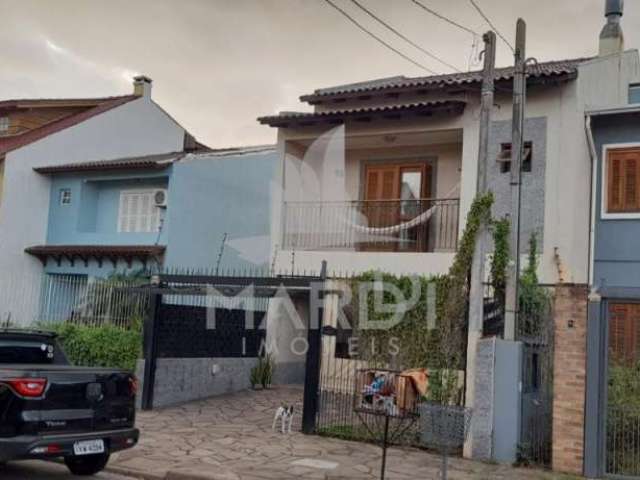 Casa com 3 quartos à venda na Rua Attilio Bettio, 92, Aberta dos Morros, Porto Alegre por R$ 580.000