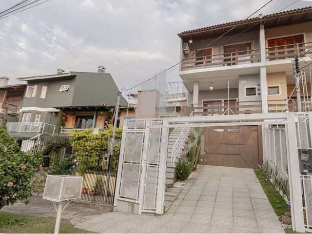 Casa com 3 quartos à venda na Avenida Doutor Francisco Roberto Dall Igna, 308, Espírito Santo, Porto Alegre por R$ 690.000