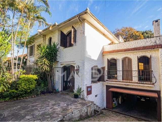 Casa com 5 quartos à venda na Rua Professor Ivo Corseuil, 129, Petrópolis, Porto Alegre por R$ 1.350.000