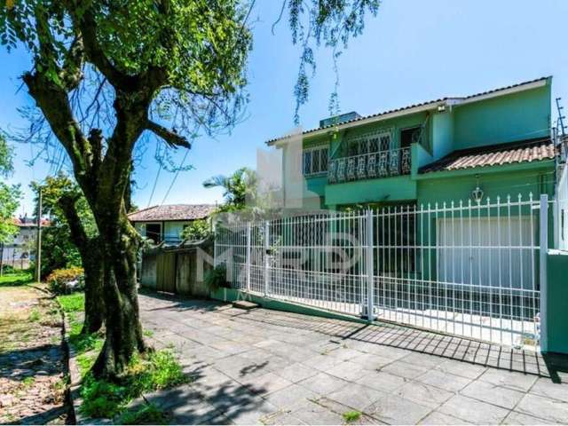 Casa com 4 quartos à venda na Rua Doutor Rodrigues Alves, 145, Chácara das Pedras, Porto Alegre por R$ 1.158.000