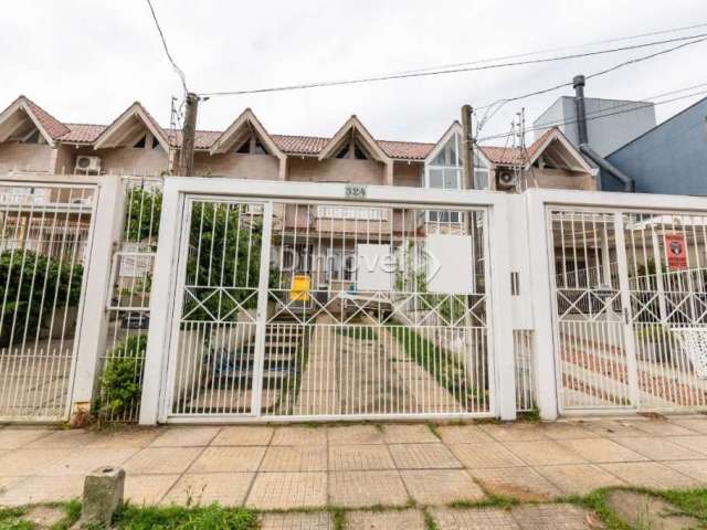 Casa com 2 quartos à venda na Rua Heitor Kramer, 324, Guarujá, Porto Alegre por R$ 450.000
