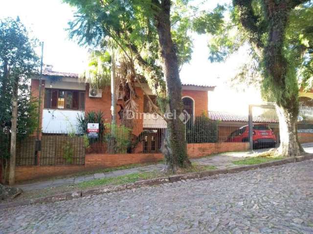 Casa com 4 quartos à venda na Rua Itapitocaí, 128, Cristal, Porto Alegre por R$ 780.000