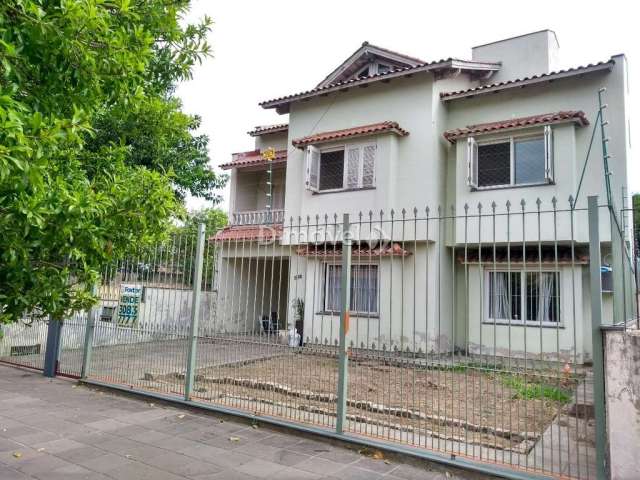 Casa com 5 quartos à venda na Rua Sílvio Silveira Soares, 2331, Camaquã, Porto Alegre por R$ 850.000