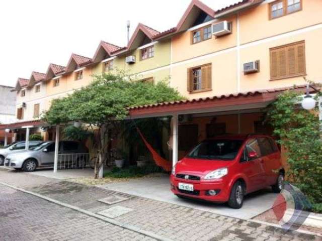 Casa em condomínio fechado com 2 quartos à venda na Rua Sílvio Silveira Soares, 2406, Camaquã, Porto Alegre por R$ 351.000