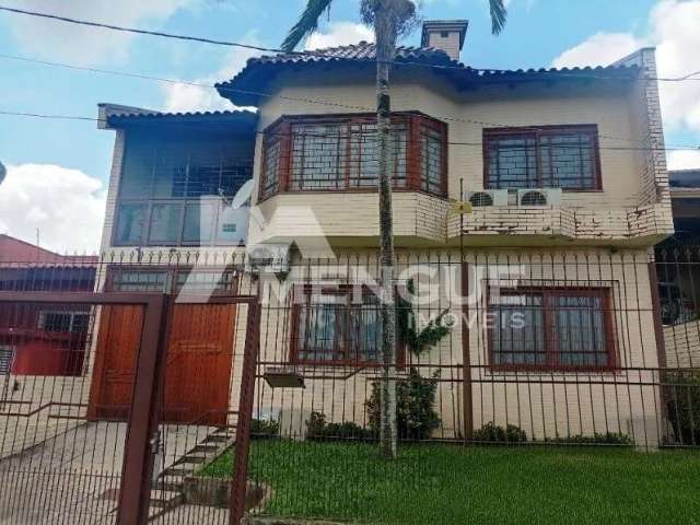 Casa com 3 quartos à venda na Rua General Telino Chagastelles, 245, Parque Santa Fé, Porto Alegre por R$ 900.000