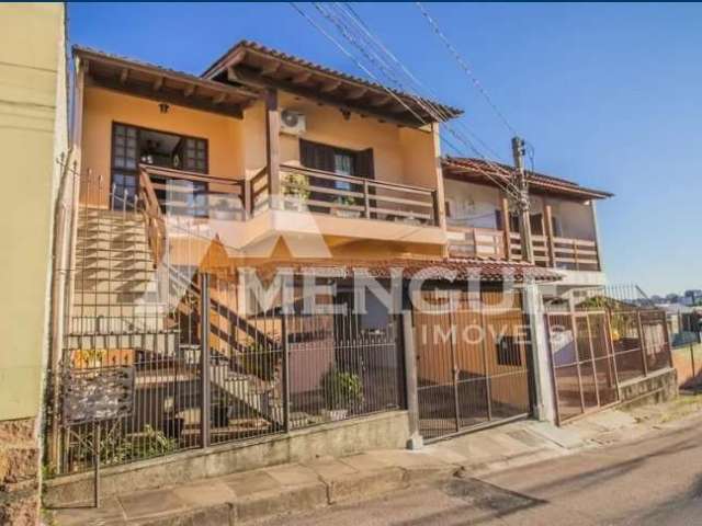 Casa com 5 quartos à venda na Rua Waldomiro Silveira Dias, 40, Jardim Itu Sabará, Porto Alegre por R$ 449.000