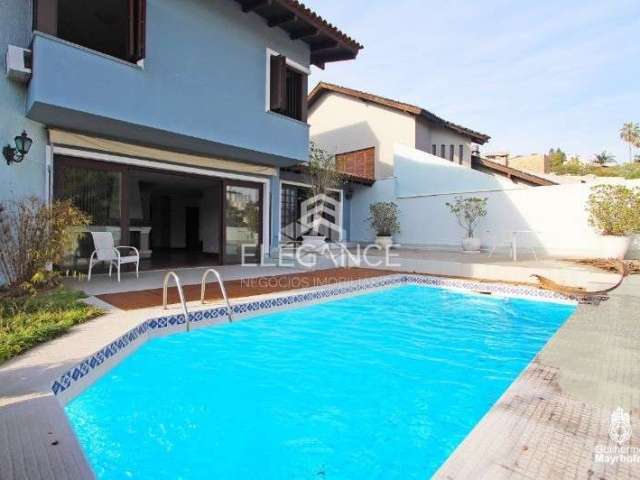 Elegance imóveis vende casa de 430m, 4 dormitórios, 3 suítes, living, piscina churrasqueira, adega e 8 vagas de garagem/box. Comprar R$ 2.400.000,00